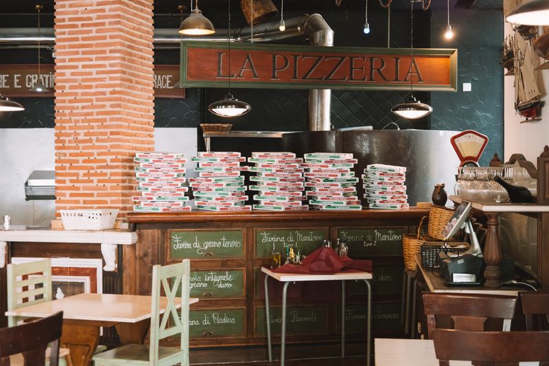 Pizza inn team members working together in restaurant